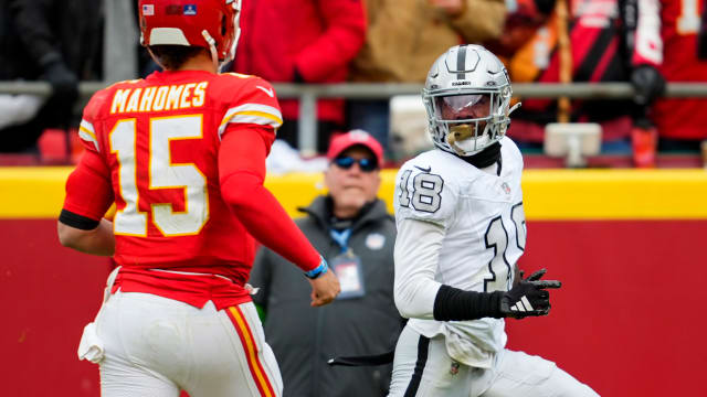 Dec 25, 2023; Kansas City, Missouri, USA; Las Vegas Raiders cornerback Jack Jones (18) returns an interception for a touchdown against Kansas City Chiefs quarterback Patrick Mahomes (15) during the first half at GEHA Field at Arrowhead Stadium. Mandatory Credit: Jay Biggerstaff-USA TODAY Sports  